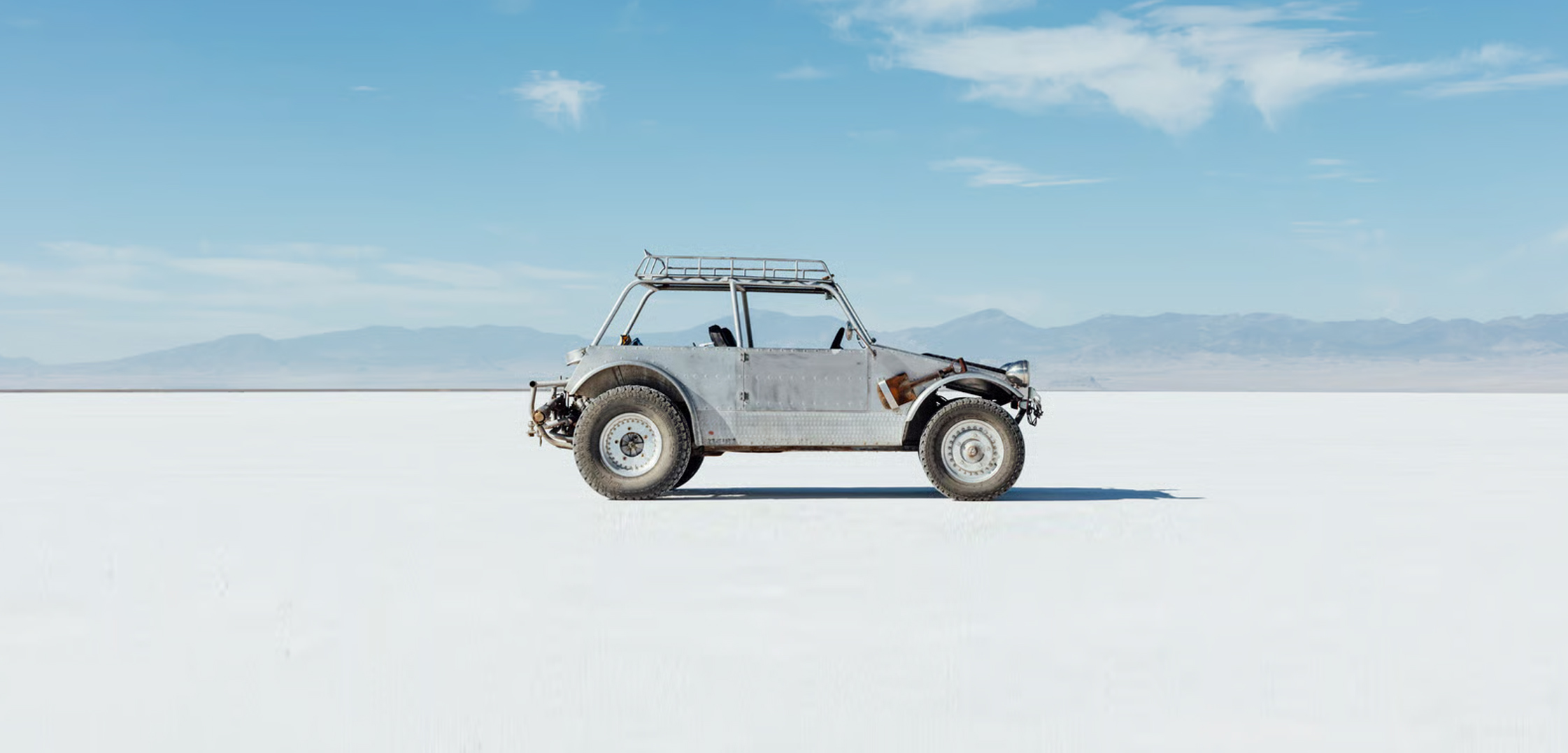 Off-road vehicle on a vast salt flat
